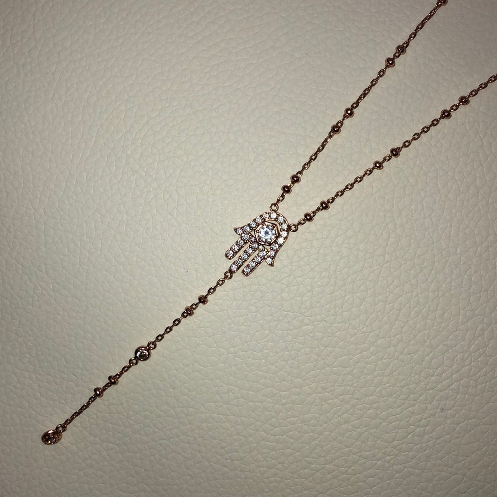 Henri Bendel long necklace Hamsa pendent